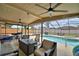 Covered patio area with comfortable seating and a view of the sparkling pool at 5313 Nichols W Dr, Lakeland, FL 33812