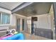 Covered patio area with a refrigerator and access to the pool and backyard at 5313 Nichols W Dr, Lakeland, FL 33812