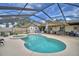 Screened-in pool area with lounge chairs, hot tub, and ample space for recreation at 5313 Nichols W Dr, Lakeland, FL 33812