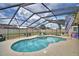Sparkling enclosed pool, surrounded by a patio, offers a refreshing retreat and ample space for lounging and recreation at 5313 Nichols W Dr, Lakeland, FL 33812