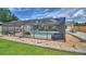 The backyard boasts a screened pool, complemented by a rock garden, creating a private and inviting outdoor space at 5313 Nichols W Dr, Lakeland, FL 33812