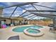 Enclosed pool and hot tub with an outdoor seating area creates a relaxing and private backyard oasis at 5313 Nichols W Dr, Lakeland, FL 33812