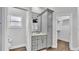 A well-designed bathroom features a modern vanity, closet, and a separate toilet at 5548 Woodwind Hills Dr, Lakeland, FL 33812