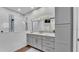 Bathroom boasting a glass-enclosed shower and modern vanity with decorative lighting at 5548 Woodwind Hills Dr, Lakeland, FL 33812