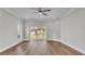 A spacious bedroom with sliding glass doors and a view of the backyard at 5548 Woodwind Hills Dr, Lakeland, FL 33812