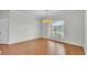 Dining area filled with natural light, hardwood floors and chandelier at 5548 Woodwind Hills Dr, Lakeland, FL 33812