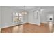 Dining area featuring hardwood floors and a modern chandelier at 5548 Woodwind Hills Dr, Lakeland, FL 33812
