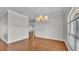 Bright dining room featuring hardwood floors and a contemporary light fixture at 5548 Woodwind Hills Dr, Lakeland, FL 33812