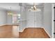 Bright entryway featuring hardwood floors and an adjacent living area at 5548 Woodwind Hills Dr, Lakeland, FL 33812
