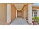 Welcoming front entry with stately columns and a view of the front door at 5548 Woodwind Hills Dr, Lakeland, FL 33812