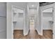 Hallway between closets with an open door to a bright, sunlit backyard at 5548 Woodwind Hills Dr, Lakeland, FL 33812
