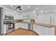 Bright modern kitchen features stainless steel appliances, granite countertops, and ample cabinet space at 5548 Woodwind Hills Dr, Lakeland, FL 33812