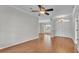 Open-concept living room with hardwood floors and natural light at 5548 Woodwind Hills Dr, Lakeland, FL 33812