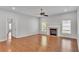 Spacious living room with a fireplace, windows, and plenty of natural light at 5548 Woodwind Hills Dr, Lakeland, FL 33812