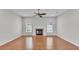 Bright living room with hardwood floors and a fireplace at 5548 Woodwind Hills Dr, Lakeland, FL 33812