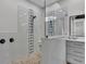 Glass enclosed shower featuring decorative tile work, shower seat, and upgraded fixtures at 5548 Woodwind Hills Dr, Lakeland, FL 33812