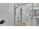 Shower featuring decorative tile work, shower seat, and modern fixtures at 5548 Woodwind Hills Dr, Lakeland, FL 33812