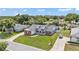 Overhead view of the property with a well-kept lawn and mature trees surrounding the home at 5579 Summerland Hills Dr, Lakeland, FL 33812