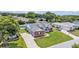 The home from above, with mature trees surrounding the property and ample parking at 5579 Summerland Hills Dr, Lakeland, FL 33812