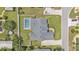 Aerial view of the home featuring a screened-in pool and fenced backyard for privacy at 5579 Summerland Hills Dr, Lakeland, FL 33812