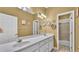 Bright bathroom with double vanity, stylish mirrors, and a convenient shower/tub combo at 5579 Summerland Hills Dr, Lakeland, FL 33812