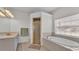 Bathroom with a soaking tub, separate glass shower, and a large window at 5579 Summerland Hills Dr, Lakeland, FL 33812