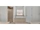Bathroom featuring a tub, tiled flooring, a walk in shower, and natural light at 5579 Summerland Hills Dr, Lakeland, FL 33812