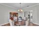 Dining room featuring a wooden table, upholstered chairs, and a wooden china cabinet at 5579 Summerland Hills Dr, Lakeland, FL 33812
