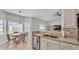 The spacious kitchen features stainless steel appliances, double sinks and a breakfast nook with an attractive light fixture at 5579 Summerland Hills Dr, Lakeland, FL 33812