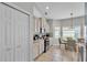 Bright kitchen with stainless steel appliances and a cozy breakfast nook featuring a quaint table and chairs at 5579 Summerland Hills Dr, Lakeland, FL 33812