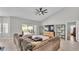 Comfortable living room with views of the backyard pool area through sliding glass doors providing abundant natural light at 5579 Summerland Hills Dr, Lakeland, FL 33812