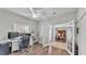 Home office featuring hardwood floors and access to the dining room through white french doors at 5579 Summerland Hills Dr, Lakeland, FL 33812