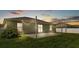 Back patio with outdoor lights, perfect for relaxation and entertaining in the backyard at 577 Majestic Gardens Blvd, Winter Haven, FL 33880