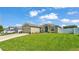 Charming single-story home with a well-manicured lawn, inviting curb appeal, and an attached two car garage at 577 Majestic Gardens Blvd, Winter Haven, FL 33880