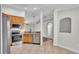 Well-equipped kitchen with stainless steel appliances, granite countertops, tile flooring, and ample storage space at 577 Majestic Gardens Blvd, Winter Haven, FL 33880