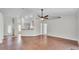 Bright and open living room featuring hardwood floors, neutral walls, providing a comfortable living space at 577 Majestic Gardens Blvd, Winter Haven, FL 33880