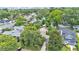 Aerial view shows a neighborhood with mature trees surrounding lovely homes and lawns at 608 Finney St, Lakeland, FL 33803