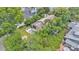 An aerial shot highlights a backyard pool and beautiful landscaping, creating a private, serene retreat at 608 Finney St, Lakeland, FL 33803