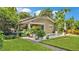 Beautiful home with a backyard pool, outdoor seating, and lush landscaping, perfect for relaxation at 608 Finney St, Lakeland, FL 33803