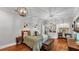 Spacious bedroom featuring hardwood floors, stylish lighting, and a built-in desk and shelving unit at 608 Finney St, Lakeland, FL 33803