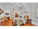 Cozy bedroom with hardwood floors, stylish lighting, and comfortable furnishings at 608 Finney St, Lakeland, FL 33803