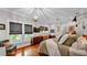 Bright bedroom with hardwood floors, large windows, stylish furnishings, and a view to the en suite bathroom at 608 Finney St, Lakeland, FL 33803