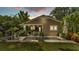 Charming backyard features a pristine pool, lush greenery, and inviting outdoor seating at 608 Finney St, Lakeland, FL 33803