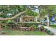 Beautiful home exterior with a well-manicured yard and a welcoming covered porch area at 608 Finney St, Lakeland, FL 33803