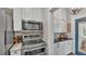 Modern kitchen with stainless steel appliances, gas range, and white cabinetry at 608 Finney St, Lakeland, FL 33803