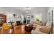 Cozy living room features a fireplace, hardwood floors, and a comfortable sectional sofa at 608 Finney St, Lakeland, FL 33803
