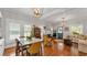 Bright, open-concept living and dining area featuring hardwood floors and abundant natural light at 608 Finney St, Lakeland, FL 33803