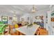 Open-concept living and dining area with hardwood floors and stylish furnishings at 608 Finney St, Lakeland, FL 33803