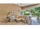 Relaxing outdoor patio featuring a comfortable sectional sofa and views of the pool at 608 Finney St, Lakeland, FL 33803
