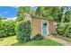 Charming backyard shed surrounded by lush greenery, offering extra storage space at 608 Finney St, Lakeland, FL 33803
